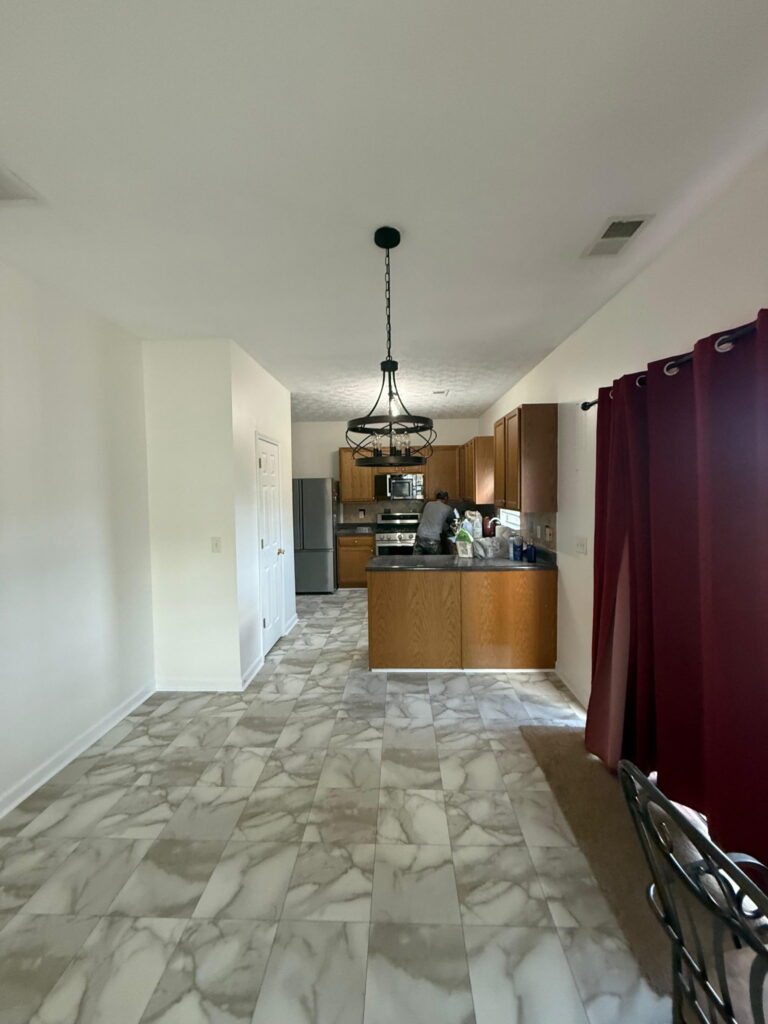 Open kitchen with new vinyl plank flooring