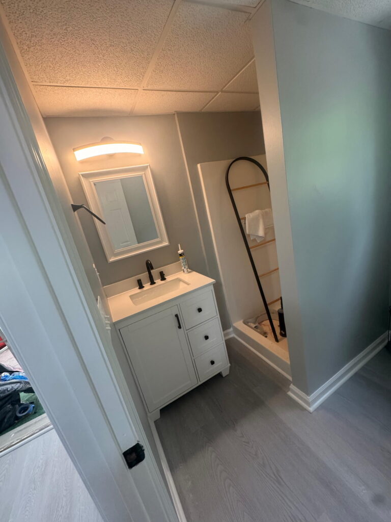 Remodeled bathroom with gray vanity