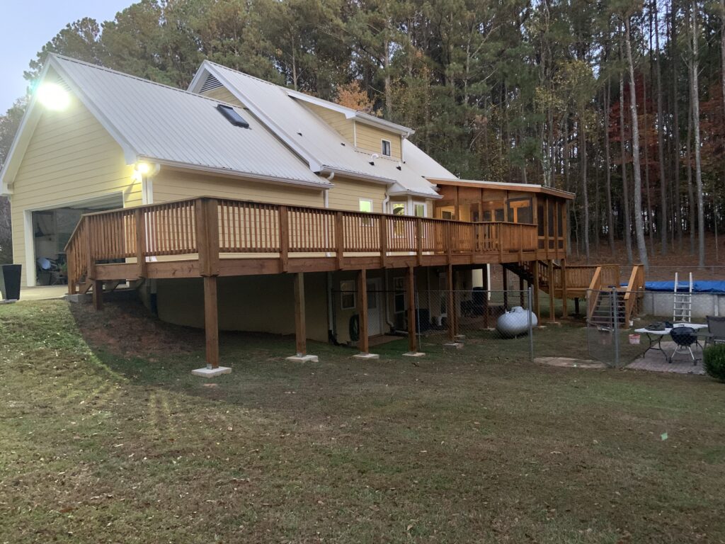Home with rear deck and metal roof
