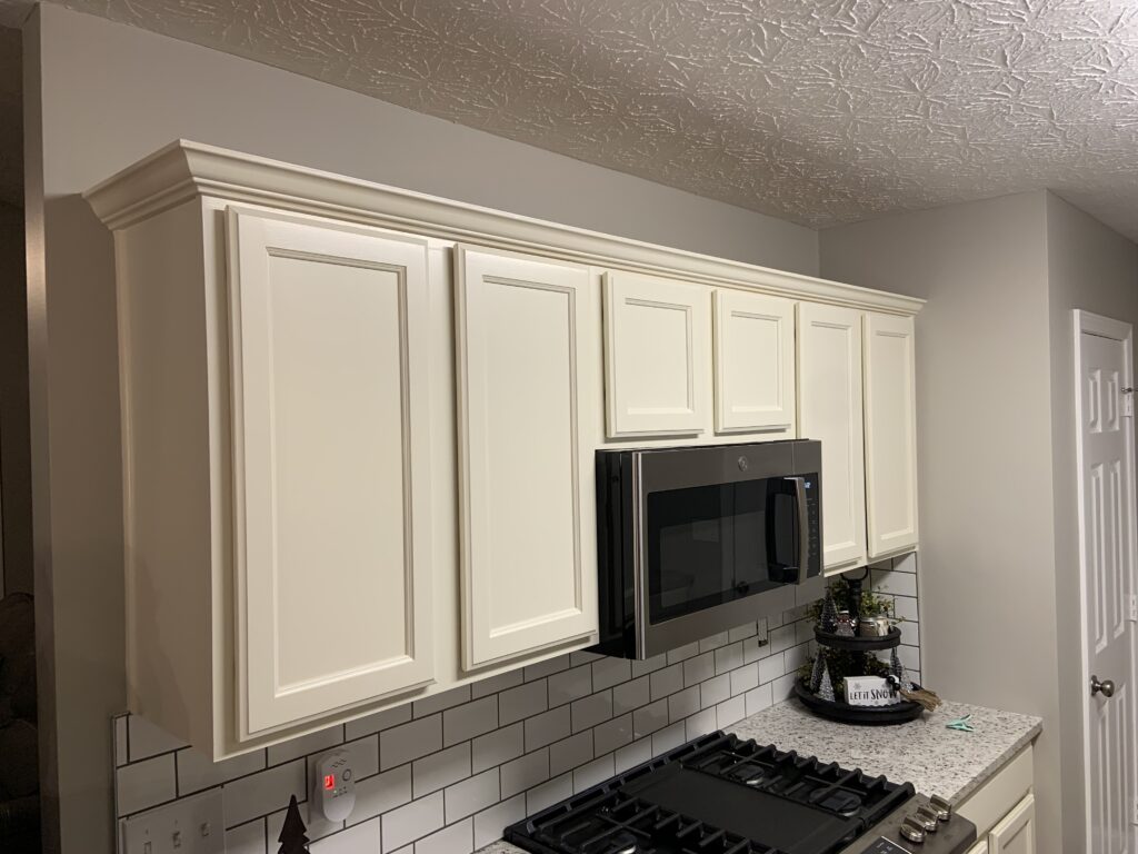 White kitchen cabinets with subway tile backsplash