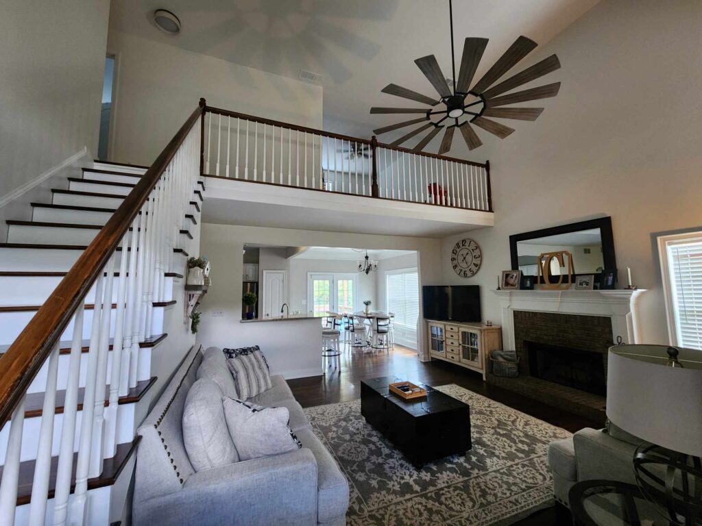 Living room and staircase with hardwood floors