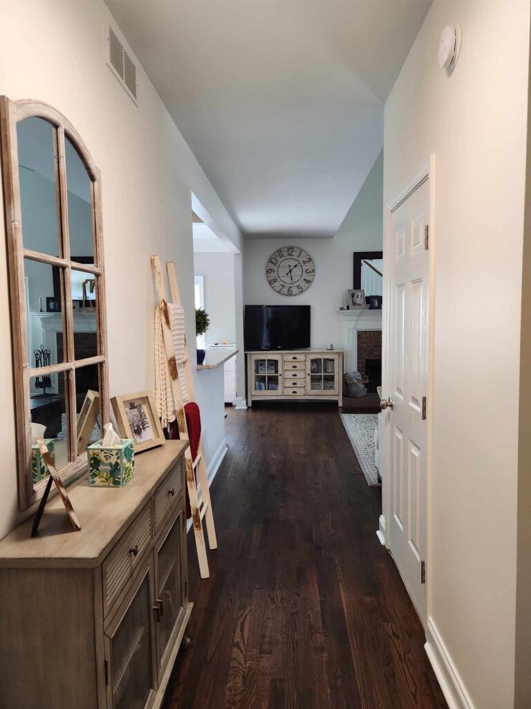 Hallway with dark hardwood floors