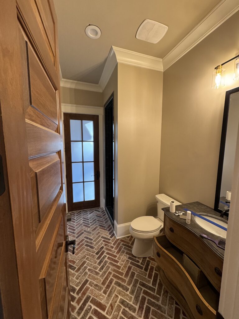 Bathroom with new herringbone tile floor