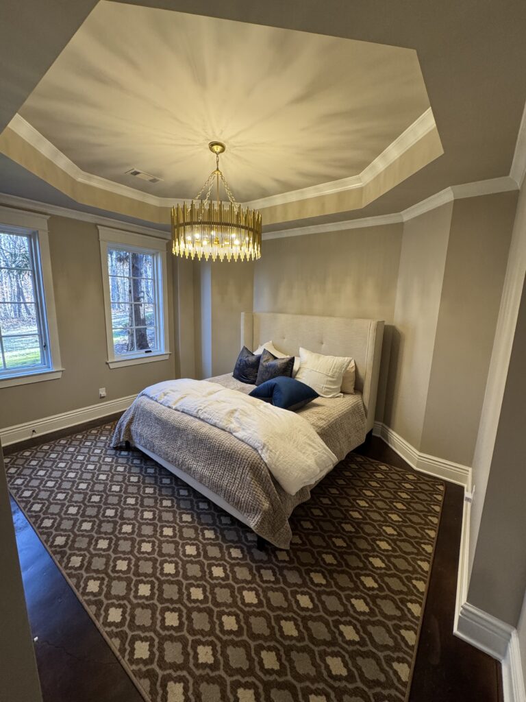 Bedroom with new carpet and tray ceiling