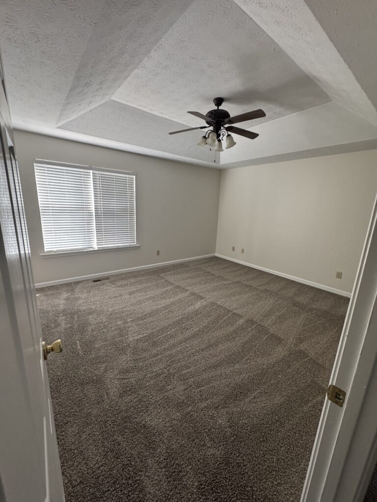 Bedroom with new gray carpet