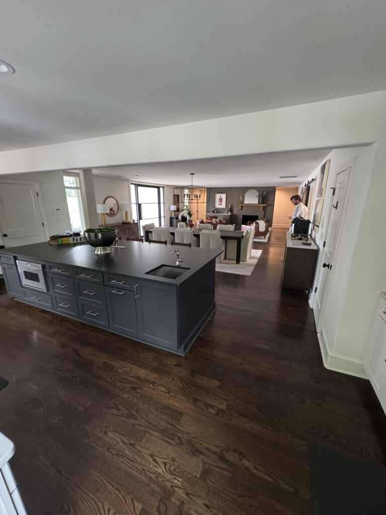 Kitchen island with dark hardwood floors