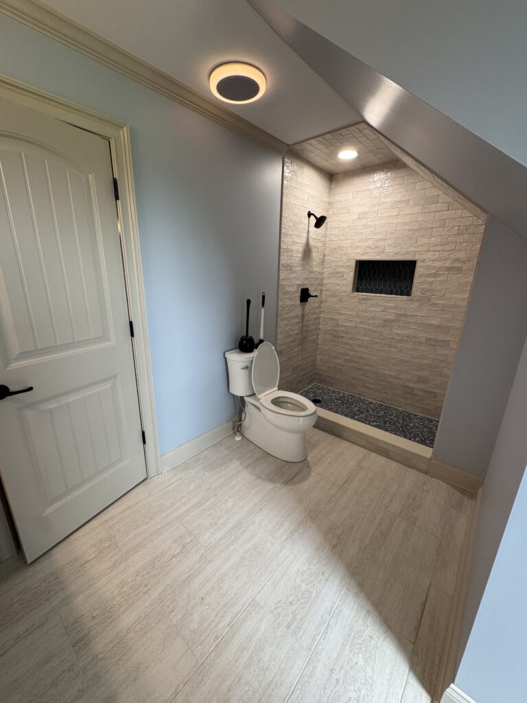 Remodeled bathroom with modern tile shower