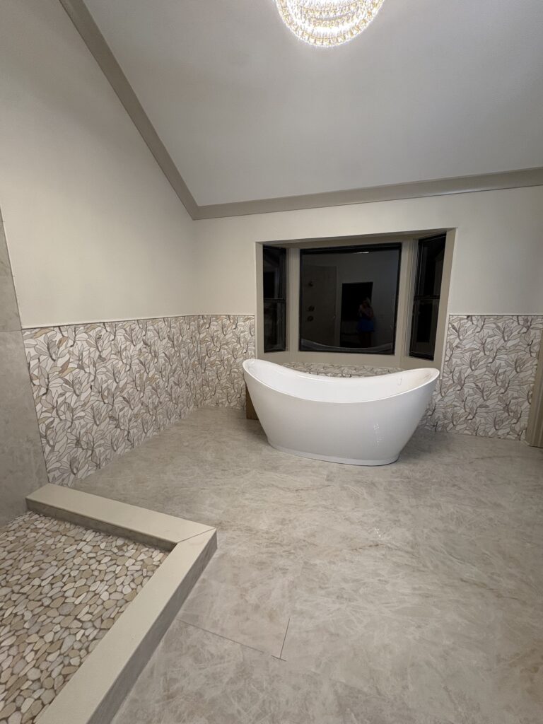 Freestanding tub with marble tile
