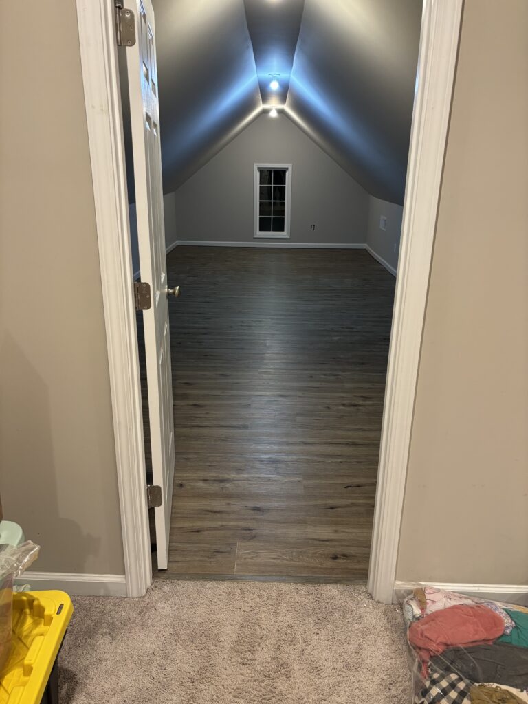Finished attic room with new vinyl plank flooring